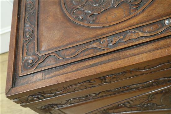A Chinese relief carved camphorwood chest, W.104cm